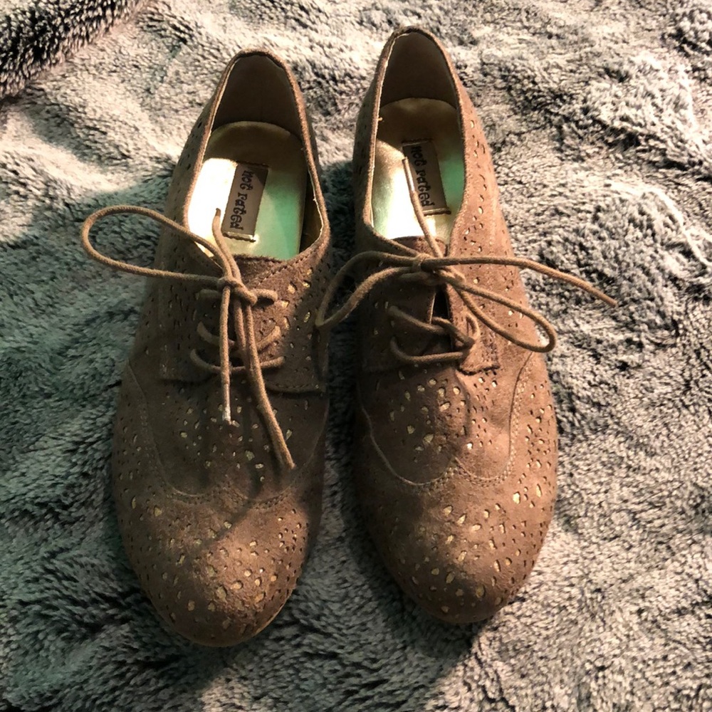 Tan and gold shoes